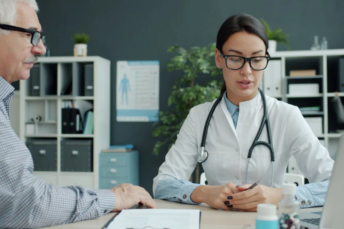 Doctor discussing health concerns with an older male patient